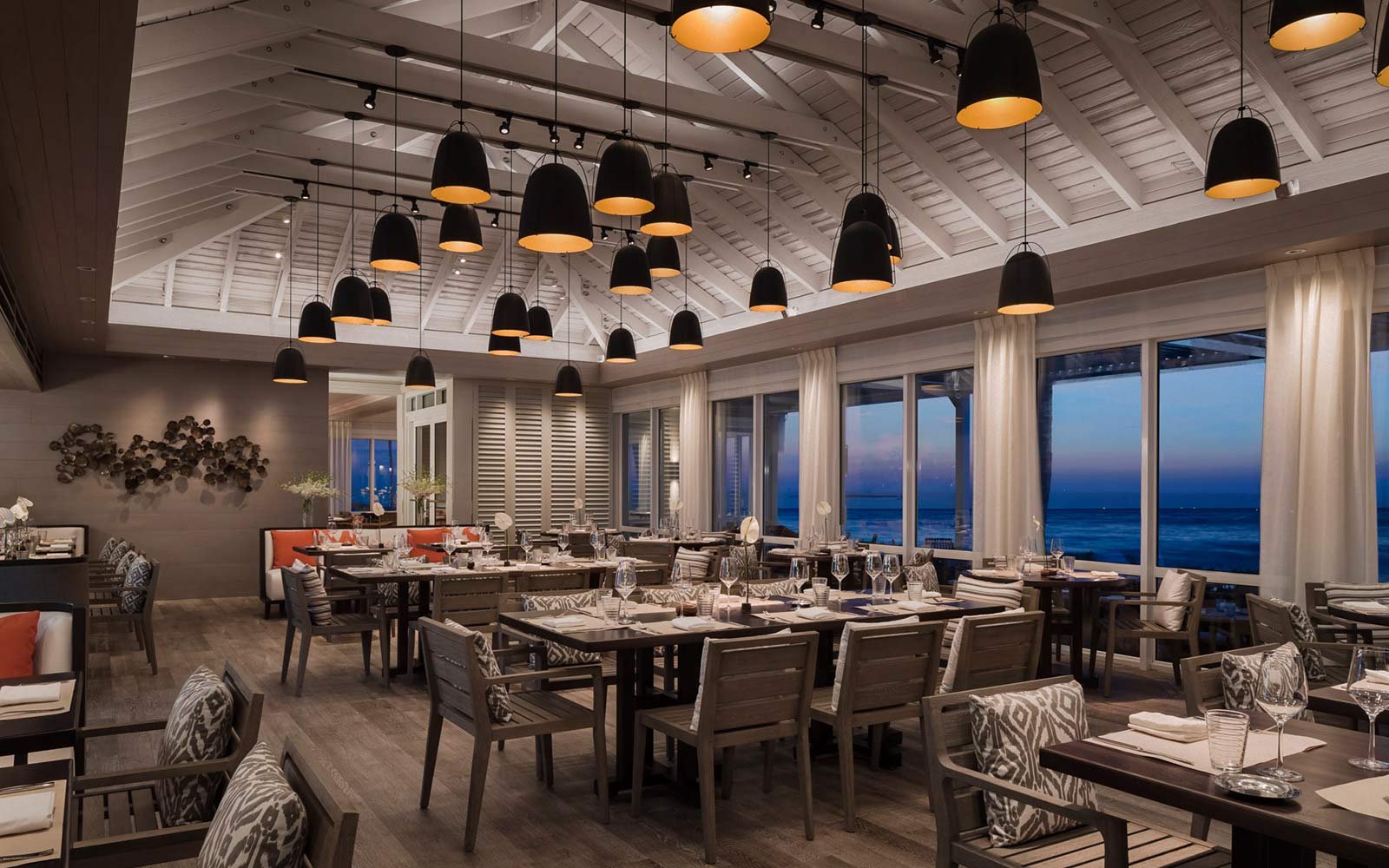 Luxury oceanfront restaurant in the Bahamas at sunset